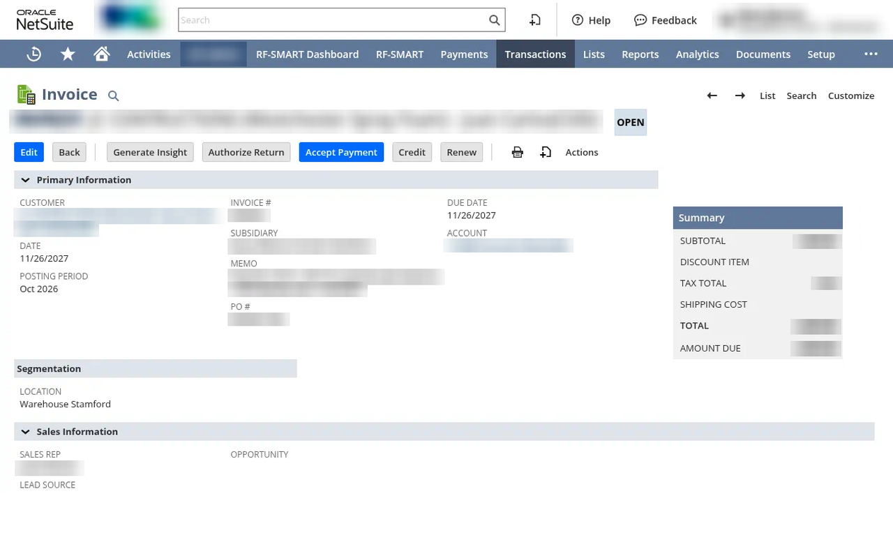 NetSuite invoice record with customer and amounts blurred